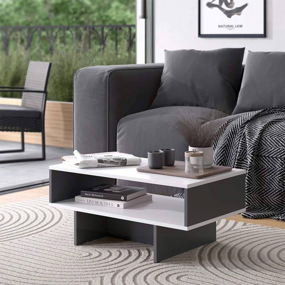 Couchtisch in Weiß/Anthrazit, dargestellt im Ambiente mit Dekoration