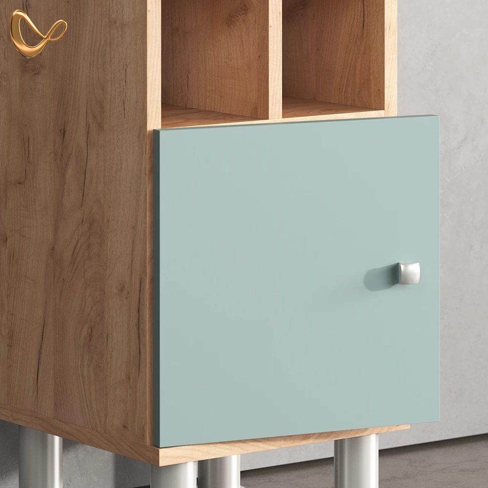 Nahaufnahme von Midischrank in Grün, zeigt Design- und Oberflächendetails