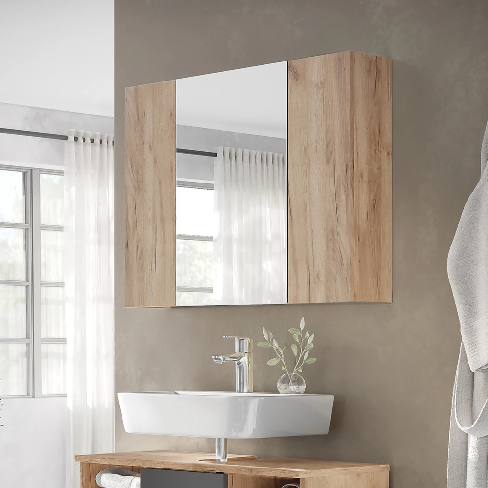 Specchio contenitore bagno in Quercia dorata, mostrato in un ambiente ambientale con decorazioni