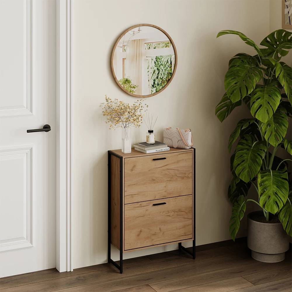 Skotipper i farven Goldkraft eg/sort, vist i et miljø med dekoration