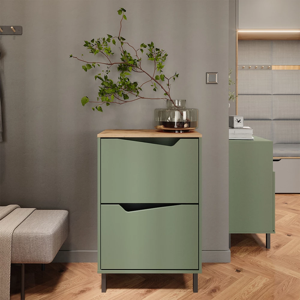 Skotipper i farven Grøn/Artisan, vist i et miljø med dekoration