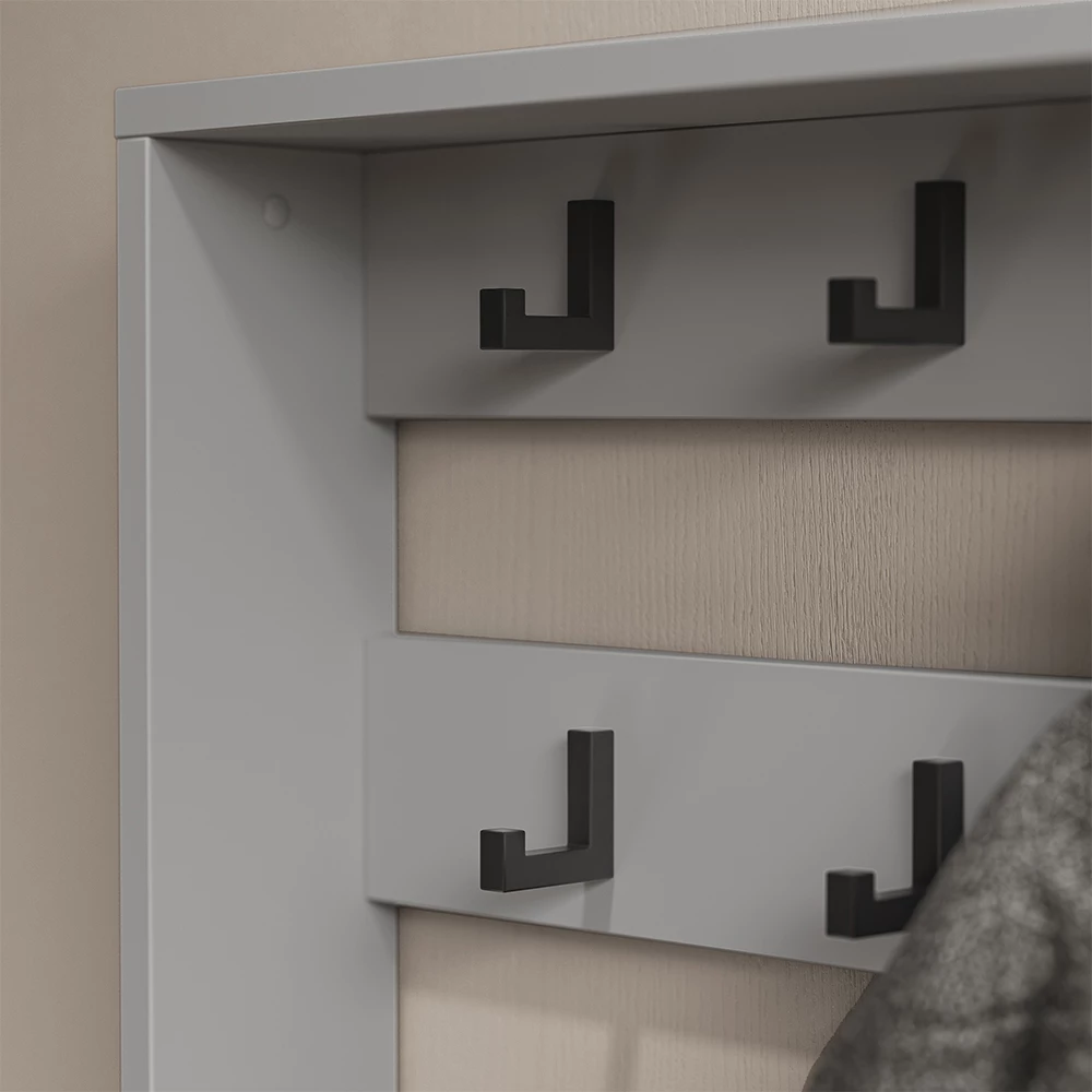 Nahaufnahme von Garderobenaufsatz  in Grau, zeigt Textur/Details