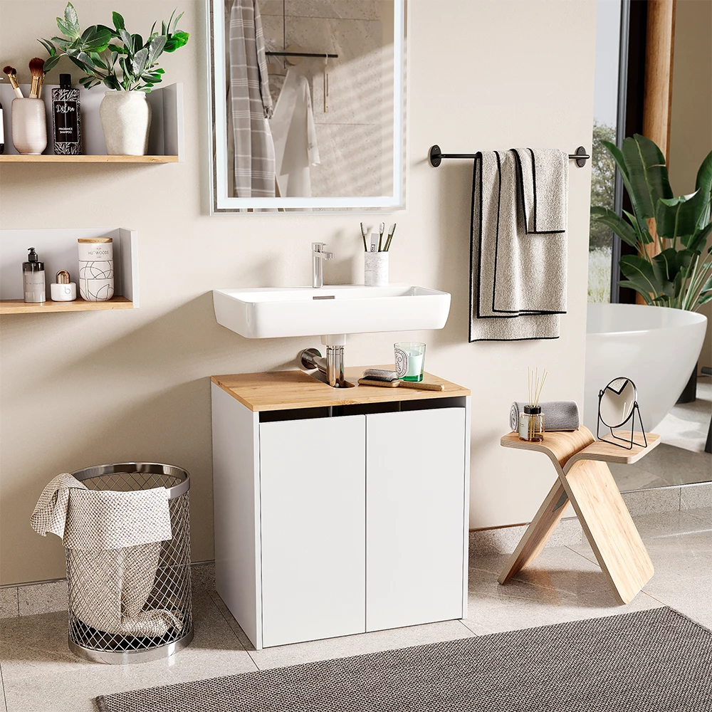 Waschbeckenunterschrank in Weiß/Artisan, dargestellt im Ambiente mit Dekoration